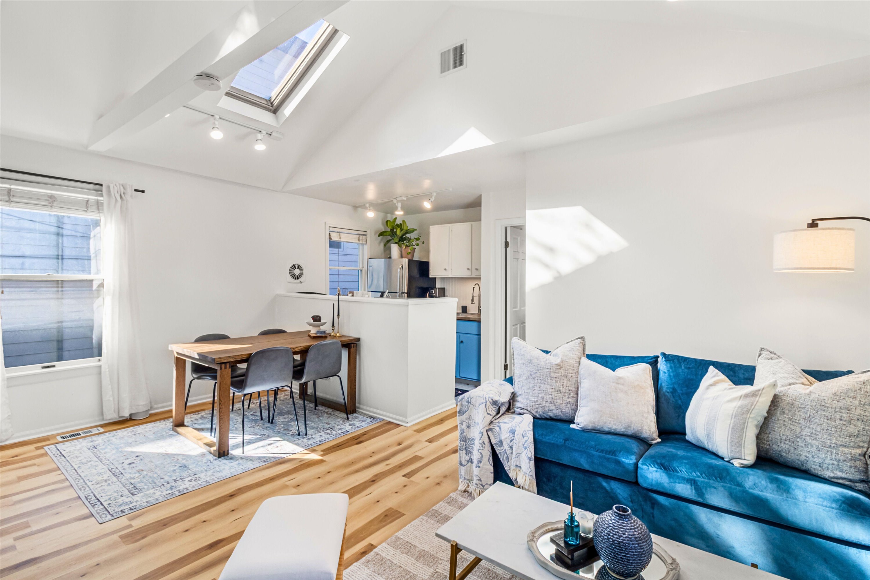 Living room with skylights and vaulted ceilings